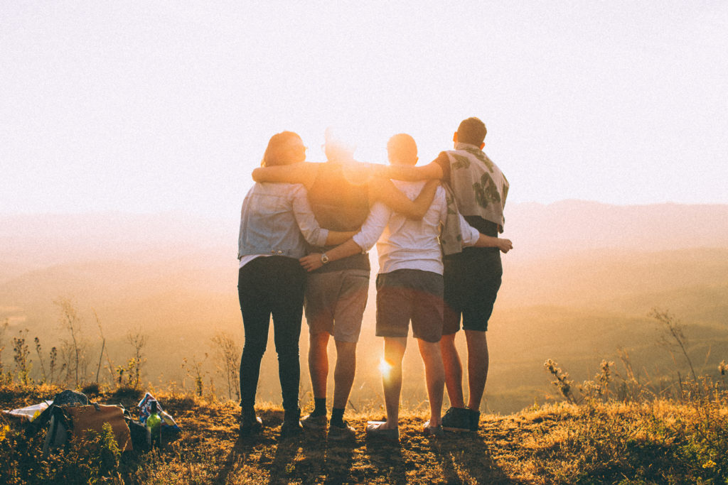 Team watching over sunset